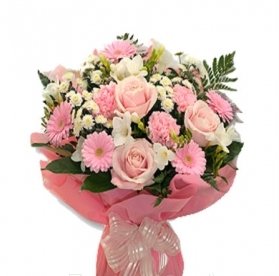 An Elegant Bouquet Of 5 Pink Roses,7 Pink Gerberas,7 White Freesia And 6 Pink Carnations